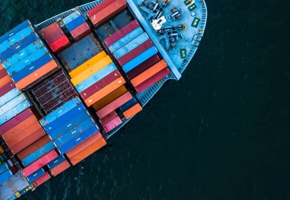 Photo of a ship with lot of containers