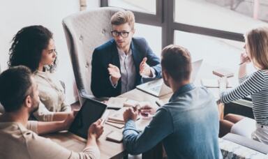 People in a group discussion in an office