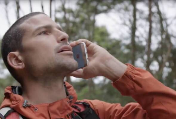 Man on a mobile phone in the bush