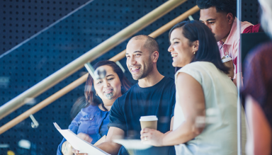 A group of people sitting on stairs