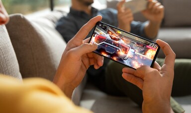 Man playing game on his mobile phone