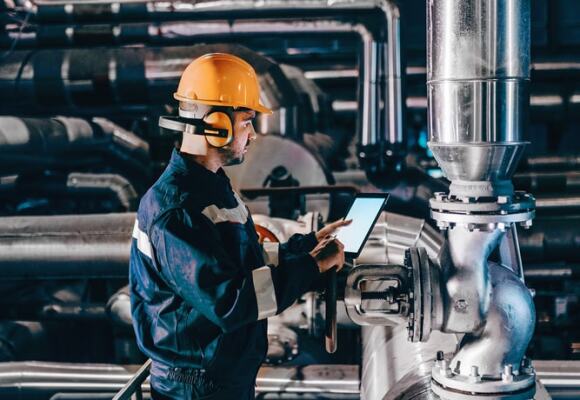 Worker in a factory using a tablet