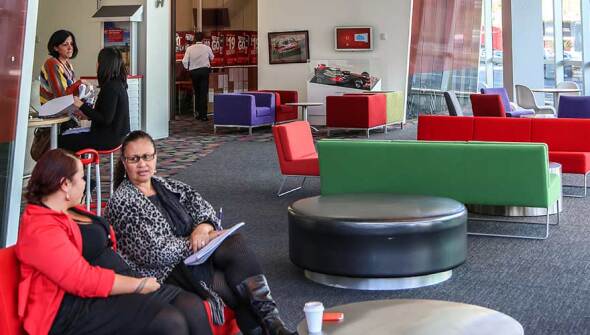 Vodafone employees talking on a couch