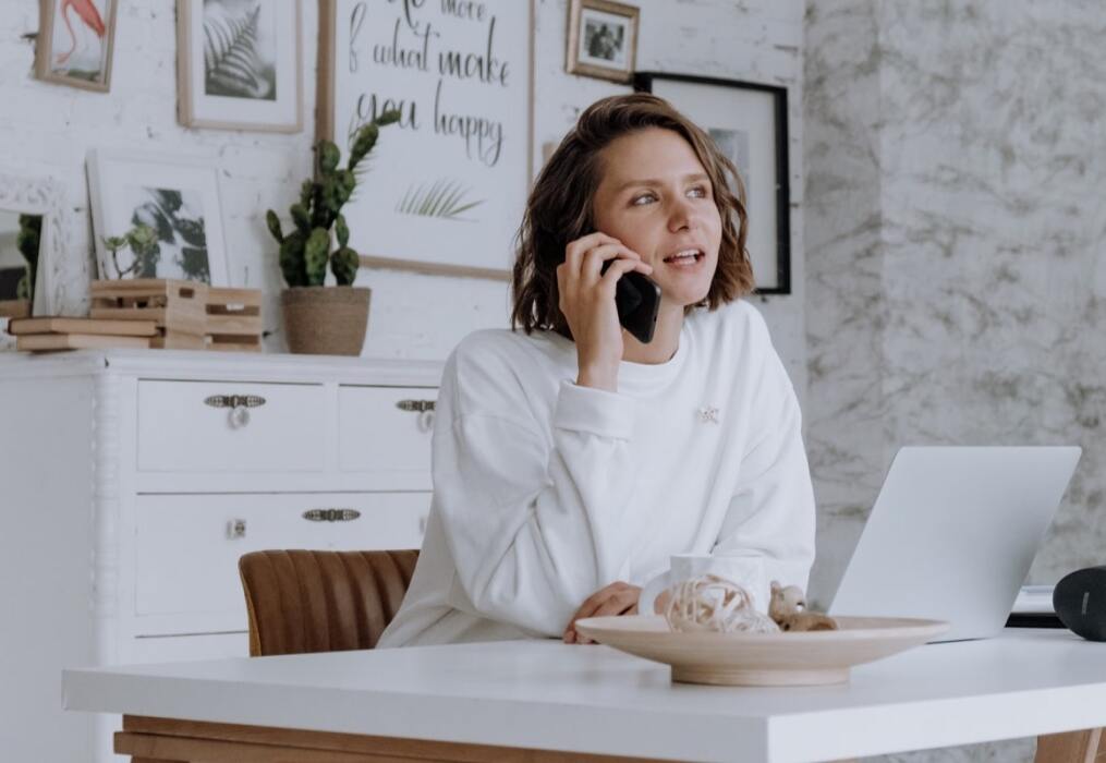 woman on the phone at her desk