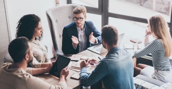 People in a group discussion in an office