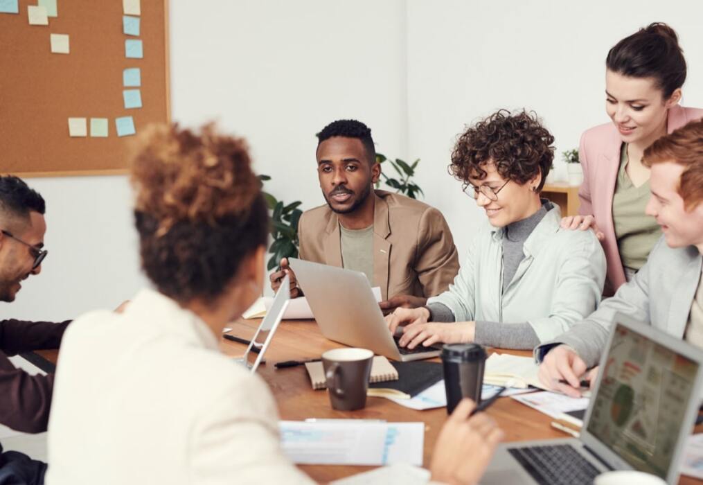 a diverse group of people at a meeting