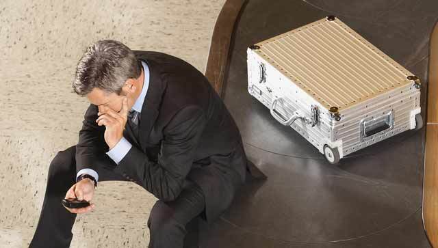 Man using phone at airport