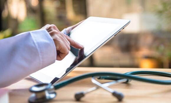 Doctor working on a tablet