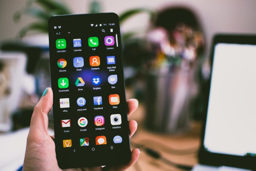 Large android phone showing home screen.