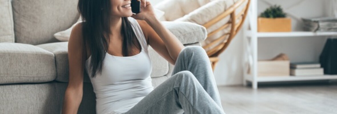 Person sitting and talking on the phone
