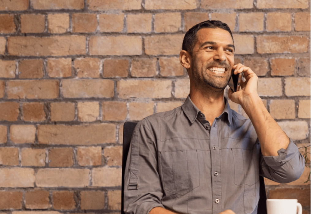Man smiling on the phone