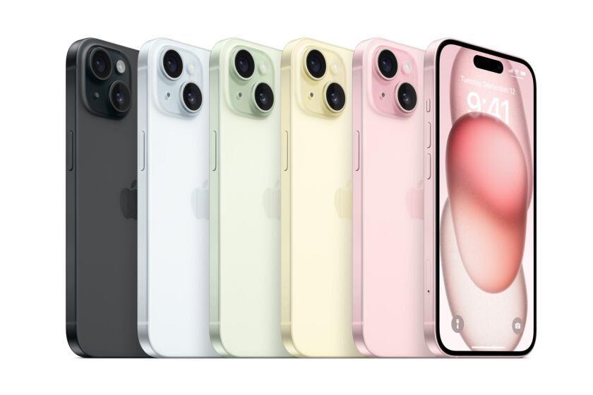 Various iPhone 15s lined up next to each other, all in different colours