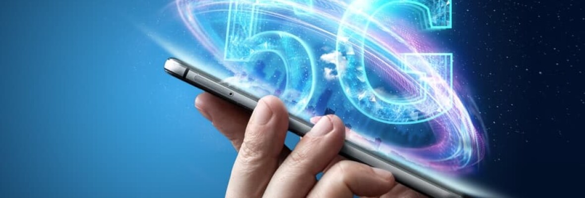 Person holding mobile phone with a 5G logo