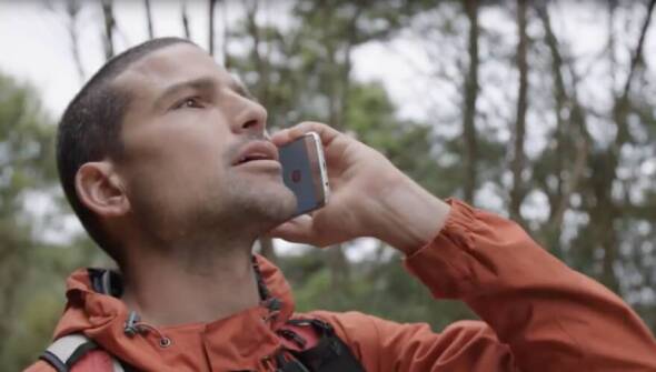 Man on a mobile phone in the bush