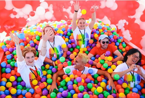 Image of people in fun rainbow ball pit.