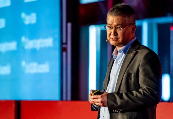 Dr Swee Tan speaking onstage at Tedx Aucklamd.