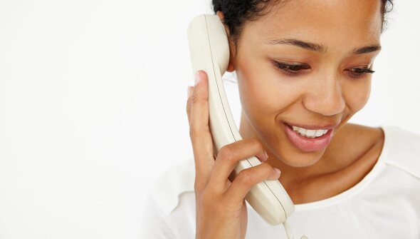 Person talking on a home phone
