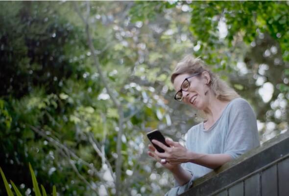 Image of person checking phone