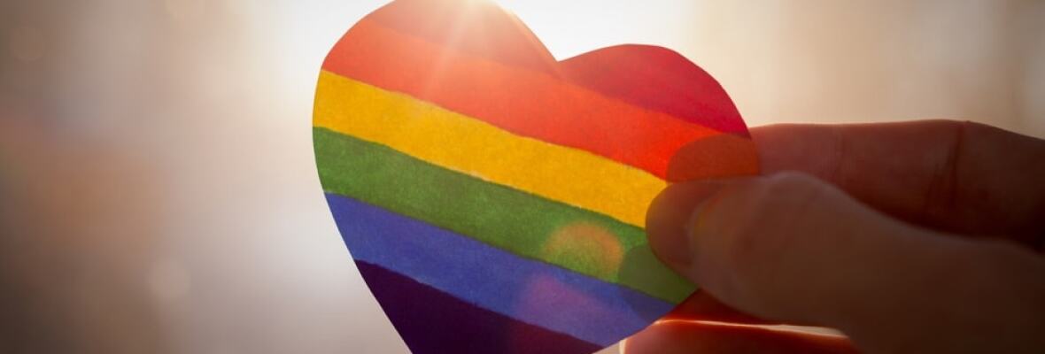 Person holding rainbow heart