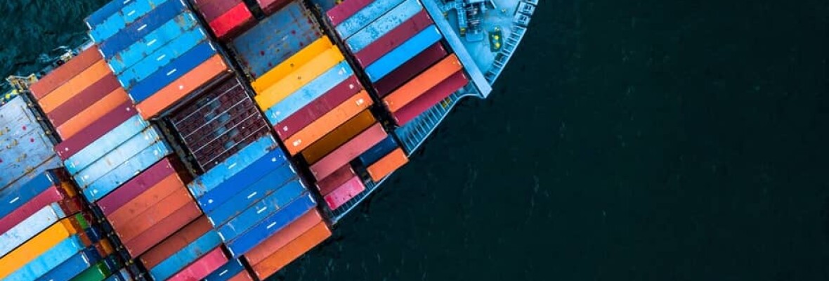 Photo of a ship with lot of containers