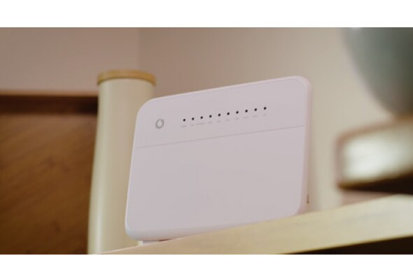 white modem kept on a shelf