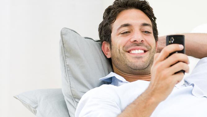 Man looking at a mobile phone