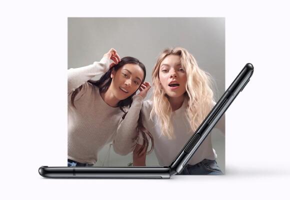 Two woman looking at Samsung Galaxy Z Flip
