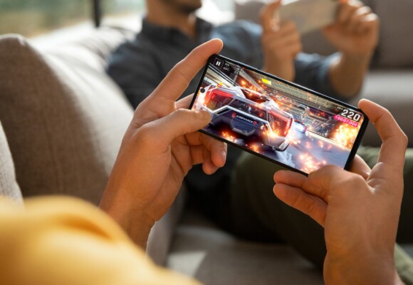 Man playing game on his mobile phone